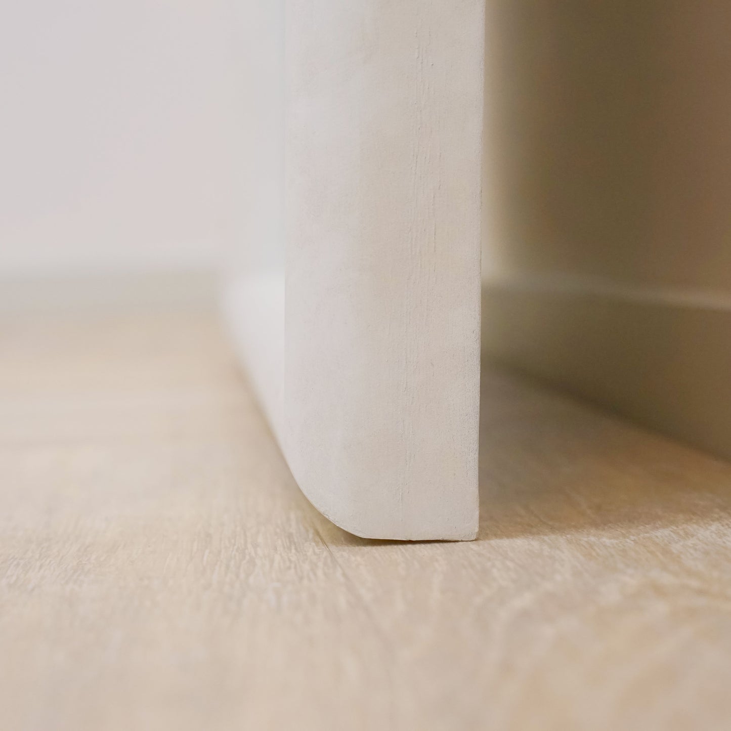 Closeup of Full length arched concrete mirror