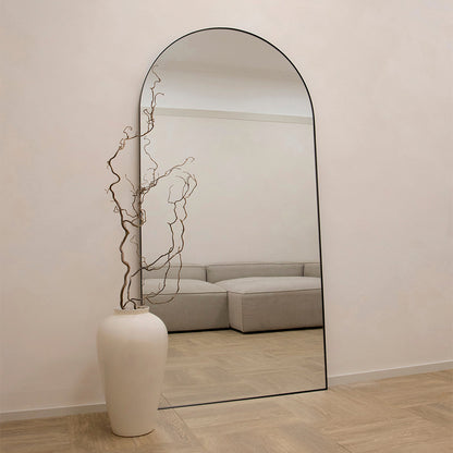 Full Length Black Arched Large Metal Mirror beside vase